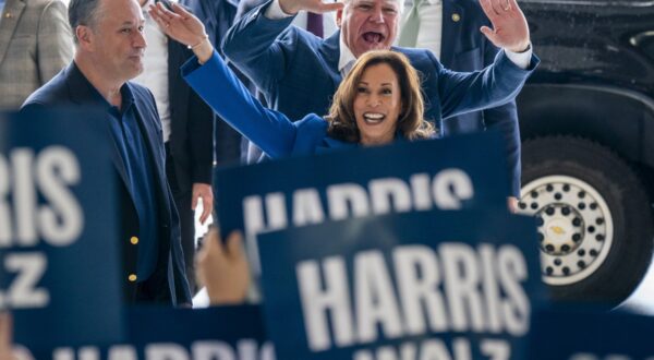 epa11554470 US Vice President and presumptive Democratic Presidential nominee Kamala Harris (R), her running mate Tim Walz (C) and Second Gentleman Doug Emhoff (L) greet supporters prior to a campaign bus tour at Pittsburgh International Airport in Pittsburgh, Pennsylvania, USA, 18 August 2024. A new CBS News national poll shows Vice President Harris with a narrow lead over former President Donald Trump.  EPA/SHAWN THEW