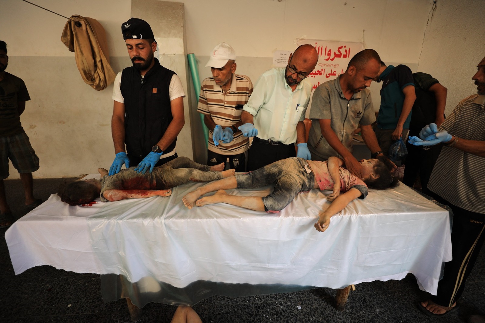 GAZA CITY, GAZA - AUGUST 04: (EDITORS NOTE: Image depicts death) The bodies of Palestinians who lost their lives after Israeli attack on a school where displaced Palestinians took shelter, are brought by their relatives to Al-Ahli Arab Hospital for burial in Gaza City, Gaza on August 04, 2024. Dawoud Abo Alkas / Anadolu/ABACAPRESS.COM,Image: 895905036, License: Rights-managed, Restrictions: , Model Release: no, Credit line: AA/ABACA / Abaca Press / Profimedia