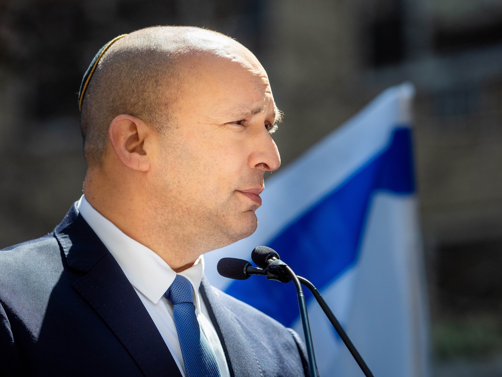 Former Israeli Prime Minister Naftali Bennett speaks to the crowd during a demonstration calling for the release of hostages from Hamas captivity. In New York City thousands of protesters convened near the United Nations Headquarters calling for the return of the remaining hostages held by Hamas. Freed hostage Louis Har alongside other hostages’ families stood in solidarity asking our government to please help. Members of Congress also attended the event. The event started by demonstrators who were chained and caged screaming for help to be freed.