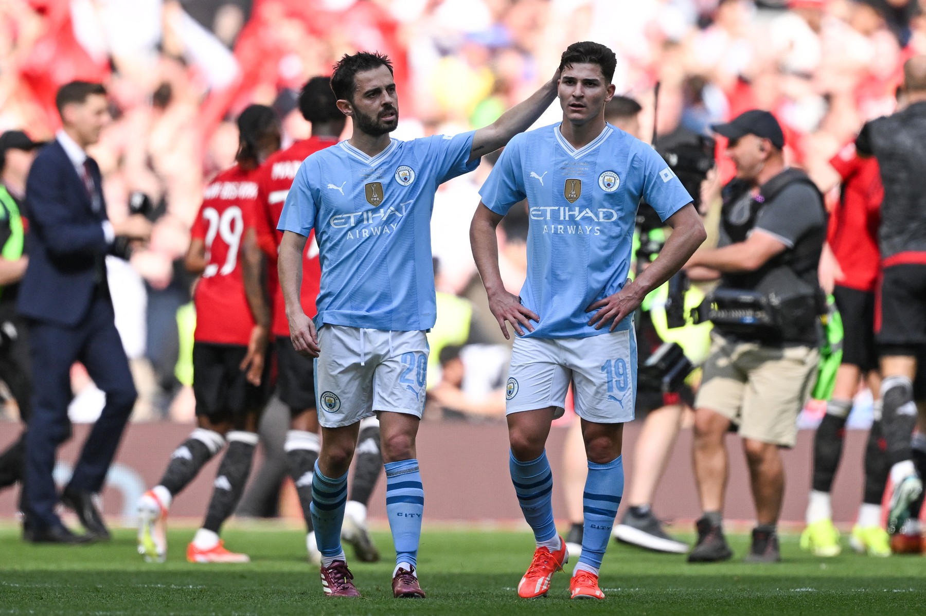 Manchester City's Portuguese midfielder #20 Bernardo Silva (L) consols Manchester City's Argentinian striker #19 Julian Alvarez after loosing the English FA Cup final football match between Manchester City and Manchester United at Wembley stadium, in London, on May 25, 2024. Manchester United wins 2 - 1 against Manchester City.,Image: 876375216, License: Rights-managed, Restrictions: NOT FOR MARKETING OR ADVERTISING USE / RESTRICTED TO EDITORIAL USE, Model Release: no, Credit line: JUSTIN TALLIS / AFP / Profimedia