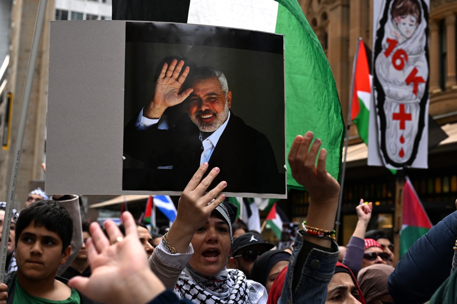 Pro-Palestinian demonstrators march through the streets of central business district to condemn the assassination of Hamas leader Ismail Haniyeh, recent Israeli strike on Lebanon and continued offensives in Gaza, during a rally in Sydney on August 4, 2024.,Image: 895799179, License: Rights-managed, Restrictions: , Model Release: no, Credit line: Saeed KHAN / AFP / Profimedia