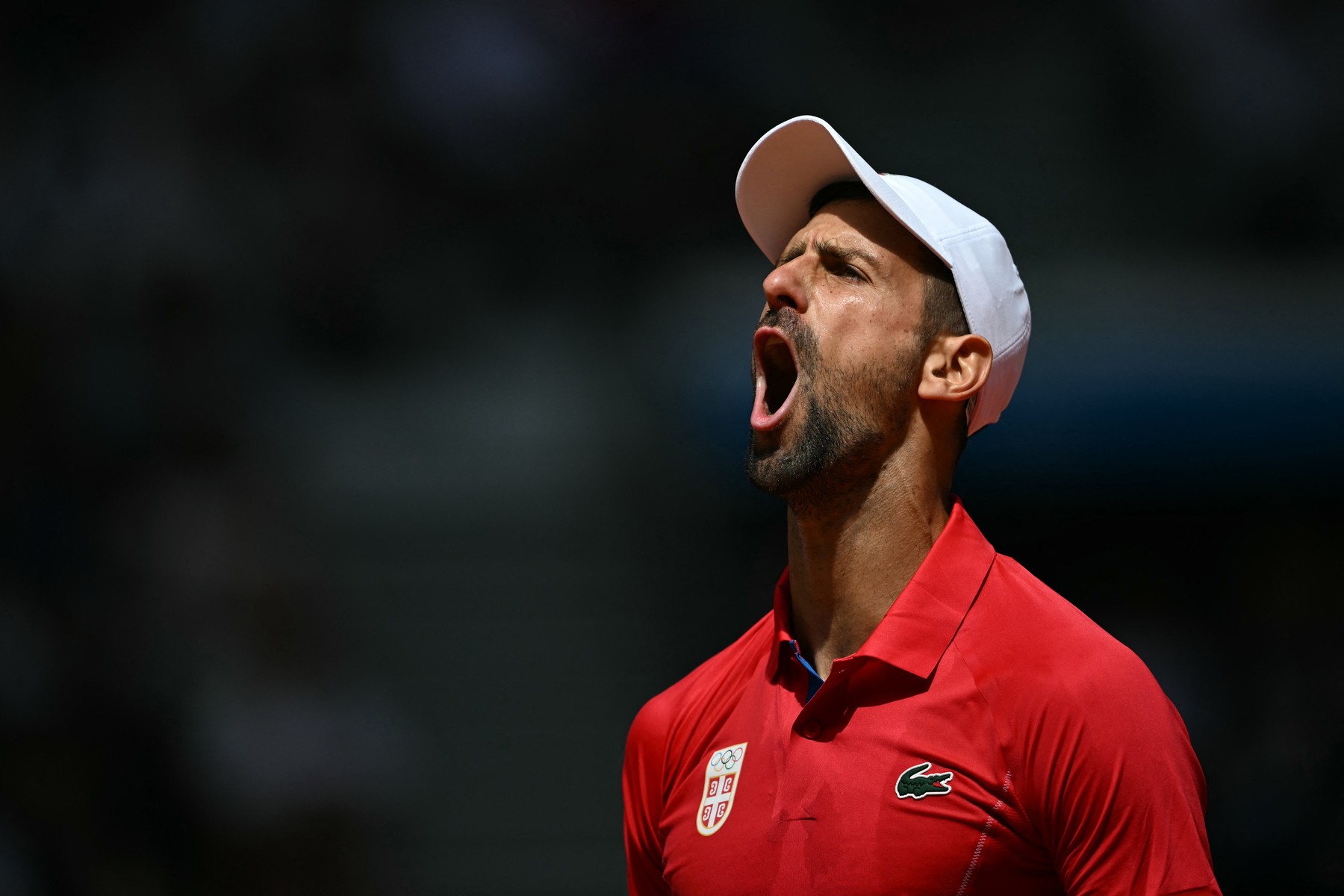 Serbia's Novak Djokovic reacts while playing Spain's Carlos Alcaraz during their men's singles final tennis match on Court Philippe-Chatrier at the Roland-Garros Stadium during the Paris 2024 Olympic Games, in Paris on August 4, 2024.,Image: 895875924, License: Rights-managed, Restrictions: , Model Release: no, Credit line: Patricia DE MELO MOREIRA / AFP / Profimedia