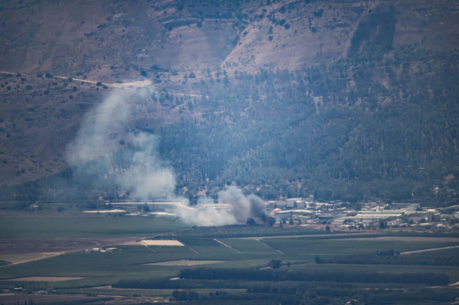 KIRYAT SHMONA, ISRAEL - AUGUST 04: Smoke rises after rockets fired from southern Lebanon hits Kiryat Shmona, Israel on August 04, 2024. Mostafa Alkharouf / Anadolu/ABACAPRESS.COM