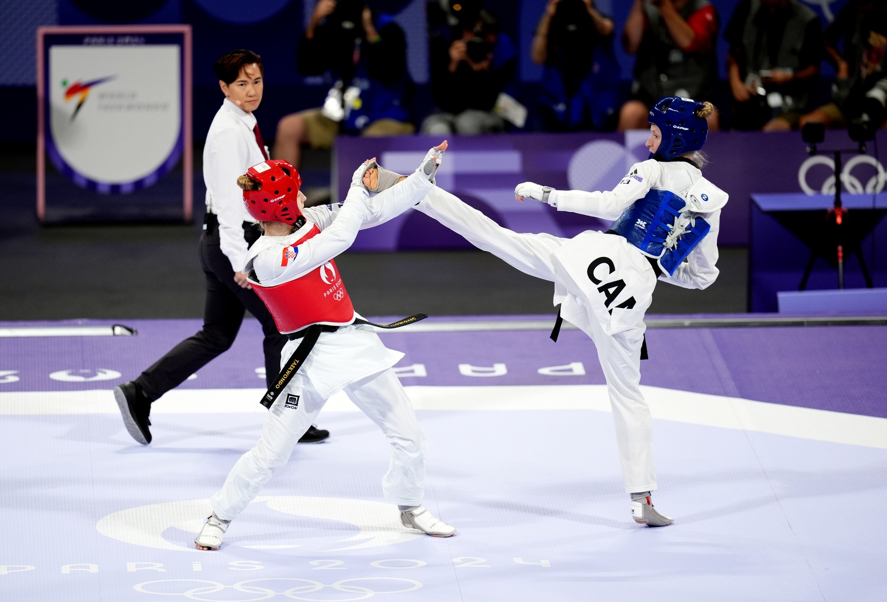 Canada's Josipa Kafadar (right) and Croatia's Lena Stojkovic during the Women's Taekwondo -49kg Round of 16 at the Grand Palais on the twelfth day of the 2024 Paris Olympic Games in France. Picture date: Wednesday August 7, 2024.,Image: 896697077, License: Rights-managed, Restrictions: Use subject to restrictions. Editorial use only, no commercial use without prior consent from rights holder., Model Release: no, Credit line: John Walton / PA Images / Profimedia