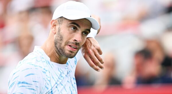 MONTREAL, CANADA - AUGUST 08: Borna Coric of Croatia looks on as he wipes his face down against Jannik Sinner of Italy in the Men's Singles second round match during Day Three of the ATP Masters 1000 National Bank Open at Stade IGA on August 8, 2024 in Montreal, Canada.   Minas Panagiotakis,Image: 897180481, License: Rights-managed, Restrictions: , Model Release: no, Credit line: Minas Panagiotakis / Getty images / Profimedia