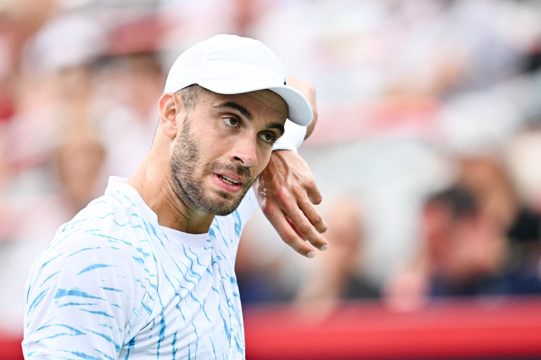 MONTREAL, CANADA - AUGUST 08: Borna Coric of Croatia looks on as he wipes his face down against Jannik Sinner of Italy in the Men's Singles second round match during Day Three of the ATP Masters 1000 National Bank Open at Stade IGA on August 8, 2024 in Montreal, Canada.   Minas Panagiotakis,Image: 897180481, License: Rights-managed, Restrictions: , Model Release: no, Credit line: Minas Panagiotakis / Getty images / Profimedia