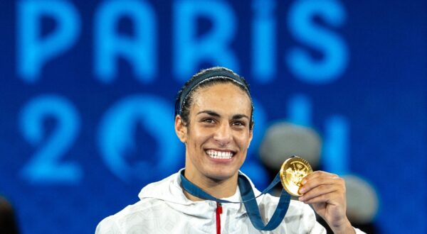 PARIS, FRANCE - AUGUST 09: Imane Khelif of Team Algeria celebrates as she wins gold medal after defeating Liu Yang (blue) of China in the Boxing Women's 66kg Final match on day fourteen of the Olympic Games Paris 2024 at Roland Garros on August 09, 2024 in Paris, France. Aytac Unal / Anadolu/ABACAPRESS.COM,Image: 897490225, License: Rights-managed, Restrictions: , Model Release: no, Credit line: AA/ABACA / Abaca Press / Profimedia