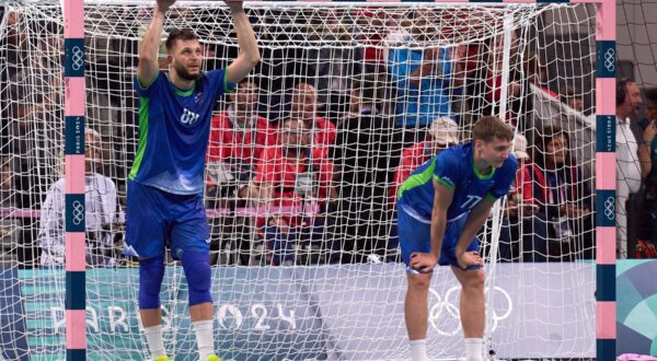 LILLE, Aug. 9, 2024  -- Aleks Vlah (L) and Domen Novak of Slovenia react after the men's semifinal of handball between Slovenia and Denmark at the Paris 2024 Olympic Games in Lille, France, on Aug. 9, 2024.,Image: 897516006, License: Rights-managed, Restrictions: , Model Release: no, Credit line: Meng Dingbo / Xinhua News / Profimedia