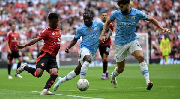 Manchester City v Manchester United, ManU FA Community Shield Amad Diallo of Manchester United tries to find a way past Ruben Dias of Manchester City during the FA Community Shield match between Manchester City and Manchester United at Wembley Stadium, London UK Newspapers OUT Copyright: xJeremyxLandeyx FIL-20475-0033,Image: 897619514, License: Rights-managed, Restrictions: , Model Release: no, Credit line: Jeremy Landey / imago sportfotodienst / Profimedia