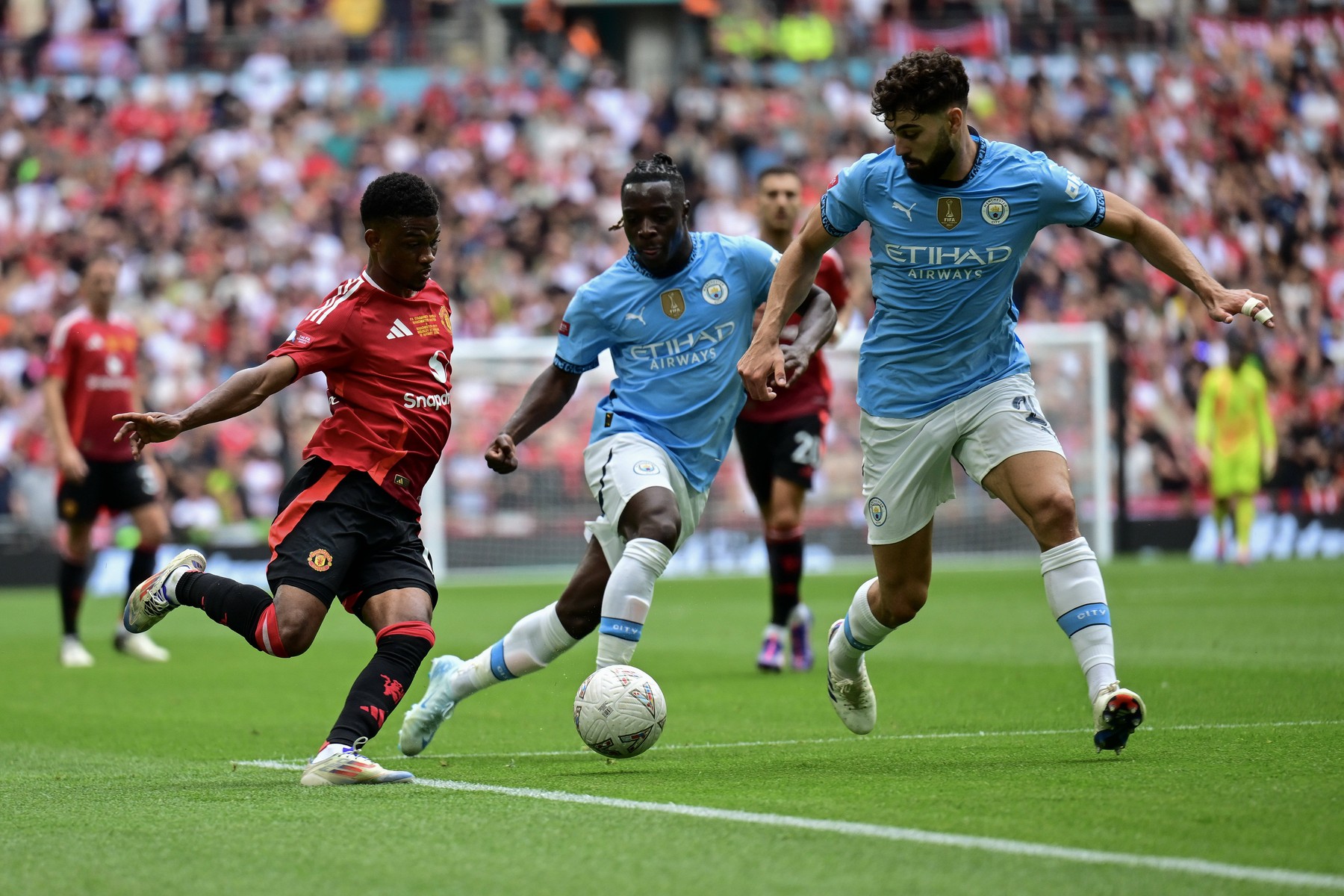 Manchester City v Manchester United, ManU FA Community Shield Amad Diallo of Manchester United tries to find a way past Ruben Dias of Manchester City during the FA Community Shield match between Manchester City and Manchester United at Wembley Stadium, London UK Newspapers OUT Copyright: xJeremyxLandeyx FIL-20475-0033,Image: 897619514, License: Rights-managed, Restrictions: , Model Release: no, Credit line: Jeremy Landey / imago sportfotodienst / Profimedia