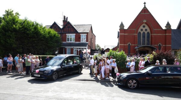 The funeral cortege leaves from St Patrick's Catholic Church in Southport, northwest England, on August 11, 2024, following a funeral service for nine-year-old Alice Da Silva Aguiar. Alice Da Silva Aguiar, Bebe King, and Elsie Dot Stancombe were all murdered during a July 29 knife attack at a Taylor Swift-themed dance party that also left another 10 people injured.,Image: 897824671, License: Rights-managed, Restrictions: , Model Release: no, Credit line: ANNABEL LEE-ELLIS / AFP / Profimedia