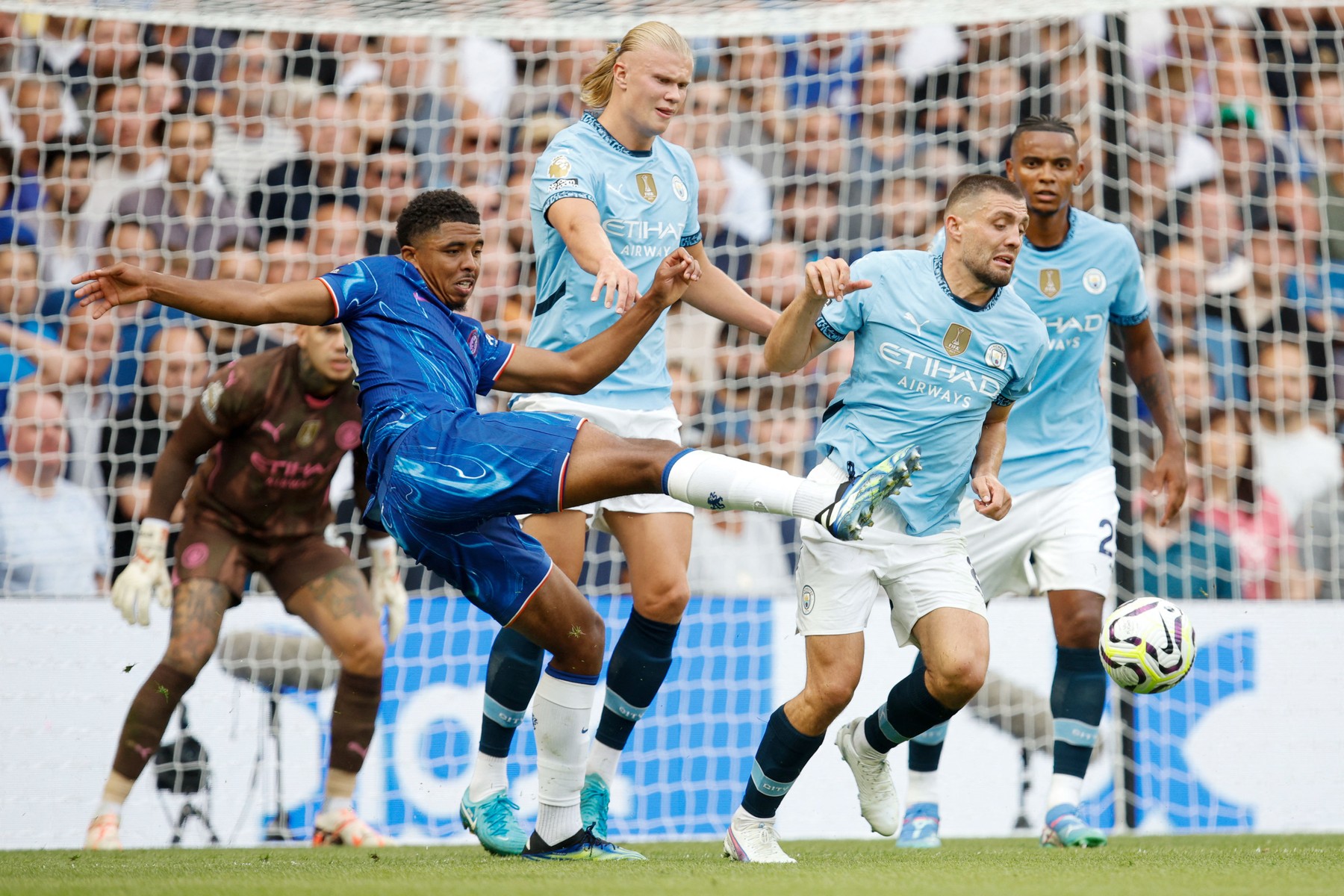 Wesley Fofana (29) of Chelsea plays the ball under pressure from Erling Haaland (9) and Mateo Kovacic (8) of Manchester City during the English championship Premier League football match between Chelsea and Manchester City on 18 August 2024 at Stamford Bridge in London, England - Photo David Cliff / ProSportsImages / DPPI,Image: 899819327, License: Rights-managed, Restrictions: Hungary Out UK Out, Model Release: no, Credit line: David Cliff / AFP / Profimedia