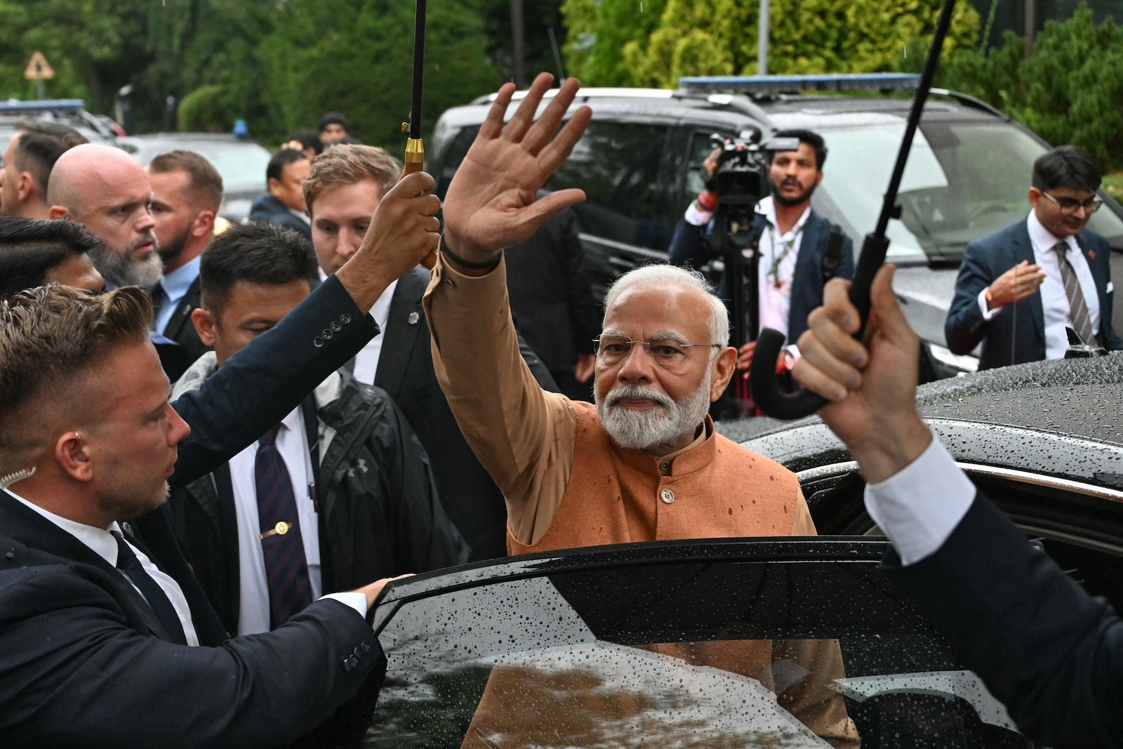 Indian Prime Minister Narendra Modi waves as he leaves after paying his respects at the Jam Saheb of Nawanagar Memorial at the Good Maharaja Square, named after Maharaja Jam Saheb of Nawanagar (1895-1966) who provided refuge to hundreds of Polish children during World War II in Warsaw, Poland on August 21, 2024.  India's Narendra Modi launched on August 21 his historic trip to Poland and Ukraine, where the premier has pledged to campaign for a peaceful resolution of Russia's invasion of Ukraine.,Image: 900420545, License: Rights-managed, Restrictions: , Model Release: no, Credit line: Sergei GAPON / AFP / Profimedia