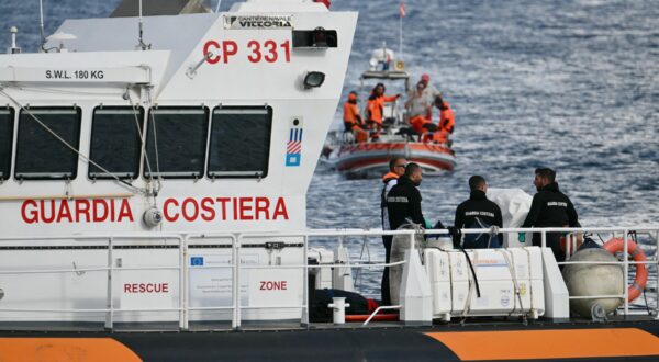 Italian Coast Guards carry a body on a rescue boat in Porticello harbor near Palermo, with a third body at the back of the boat on August 21, 2024, two days after the British-flagged luxury yacht Bayesian sank. Divers searching for six missing people following the sinking of a superyacht off Sicily in a storm have found four bodies, a source close to the search told AFP.  The Bayesian, which had 22 people aboard including 10 crew, was anchored some 700 metres from port before dawn when it was struck by a waterspout. Among the six missing were UK tech entrepreneur Mike Lynch and his 18-year-old daughter Hannah, and Jonathan Bloomer, the chair of Morgan Stanley International, and his wife Judy.,Image: 900429092, License: Rights-managed, Restrictions: , Model Release: no, Credit line: Alberto PIZZOLI / AFP / Profimedia