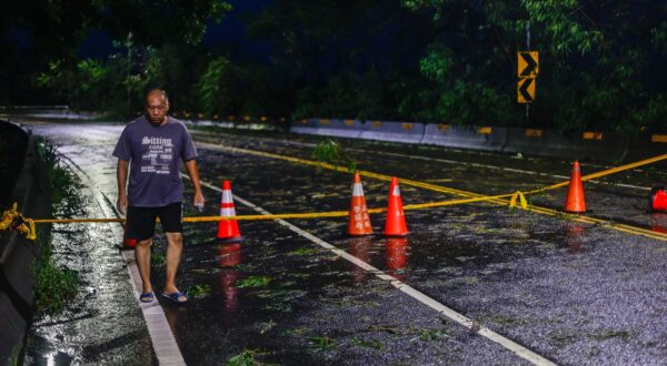 CHIAYI, TAIWAN - JULY 26: A man walks near a road that was blocked due to flooding in areas ahead following typhoon Gaemi in Chiayi, Southwestern Taiwan on 26 July, 2024. After causing widespread flooding, 6 deaths and hundreds injured in Taiwan and bringing catastrophic damage to the Philippines, the super typhoon has hit China. It has cause major losses and impacts on multiple places across East Asia and Southeast Asia. Daniel Ceng / Anadolu/ABACAPRESS.COM,Image: 892690145, License: Rights-managed, Restrictions: , Model Release: no, Credit line: AA/ABACA / Abaca Press / Profimedia