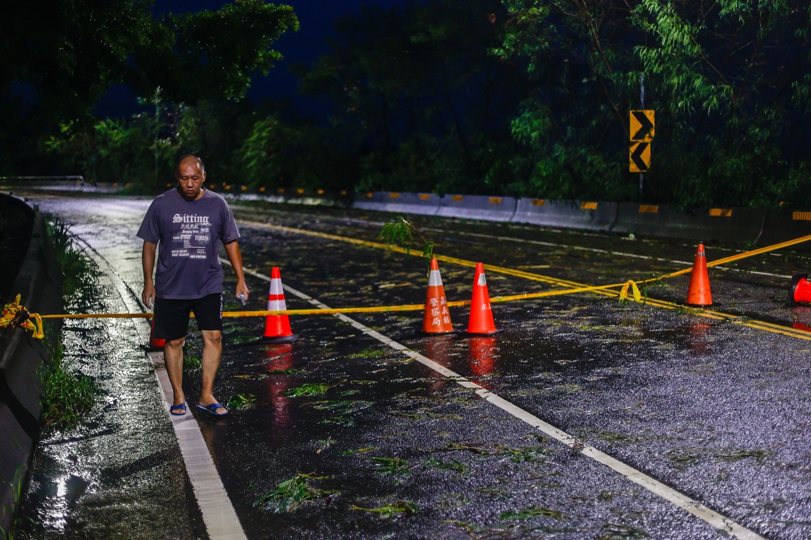 CHIAYI, TAIWAN - JULY 26: A man walks near a road that was blocked due to flooding in areas ahead following typhoon Gaemi in Chiayi, Southwestern Taiwan on 26 July, 2024. After causing widespread flooding, 6 deaths and hundreds injured in Taiwan and bringing catastrophic damage to the Philippines, the super typhoon has hit China. It has cause major losses and impacts on multiple places across East Asia and Southeast Asia. Daniel Ceng / Anadolu/ABACAPRESS.COM,Image: 892690145, License: Rights-managed, Restrictions: , Model Release: no, Credit line: AA/ABACA / Abaca Press / Profimedia