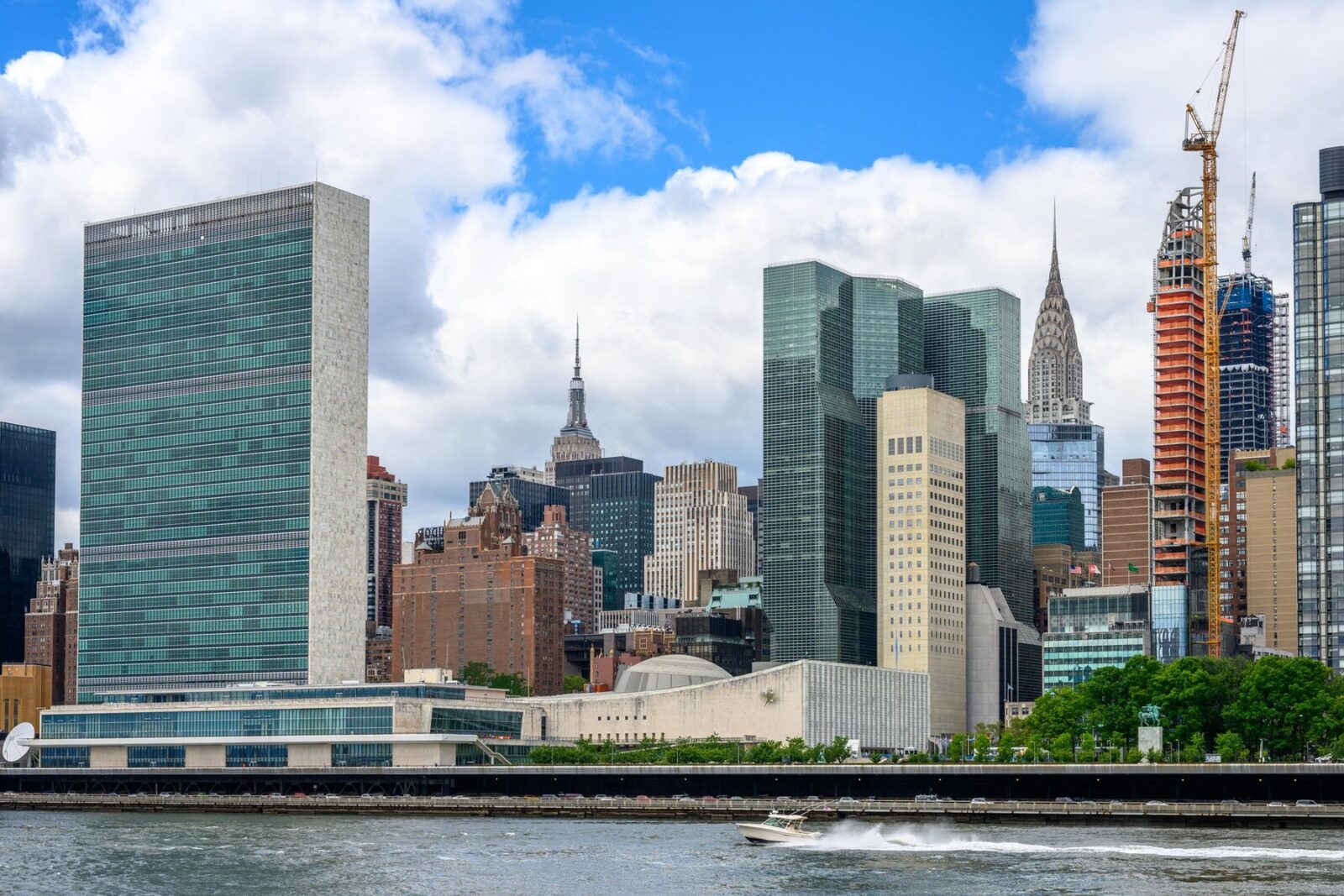 New York, USA,  14 June 2019. Buildings of New York City's Manhattan including the United Nations headquarters (L), the Empire State building (C) and the Chrysler building are seen from Roosvelt Island accross the East River.   Credit: Enrique Shore/Alamy Stock Photo,Image: 449004958, License: Rights-managed, Restrictions: , Model Release: no, Credit line: Enrique Shore / Alamy / Alamy / Profimedia