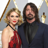 Jordyn Blum, left, and Dave Grohl arrive at the Oscars on Sunday, Feb. 28, 2016, at the Dolby Theatre in Los Angeles. (Photo by Dan Steinberg/Invision/AP)