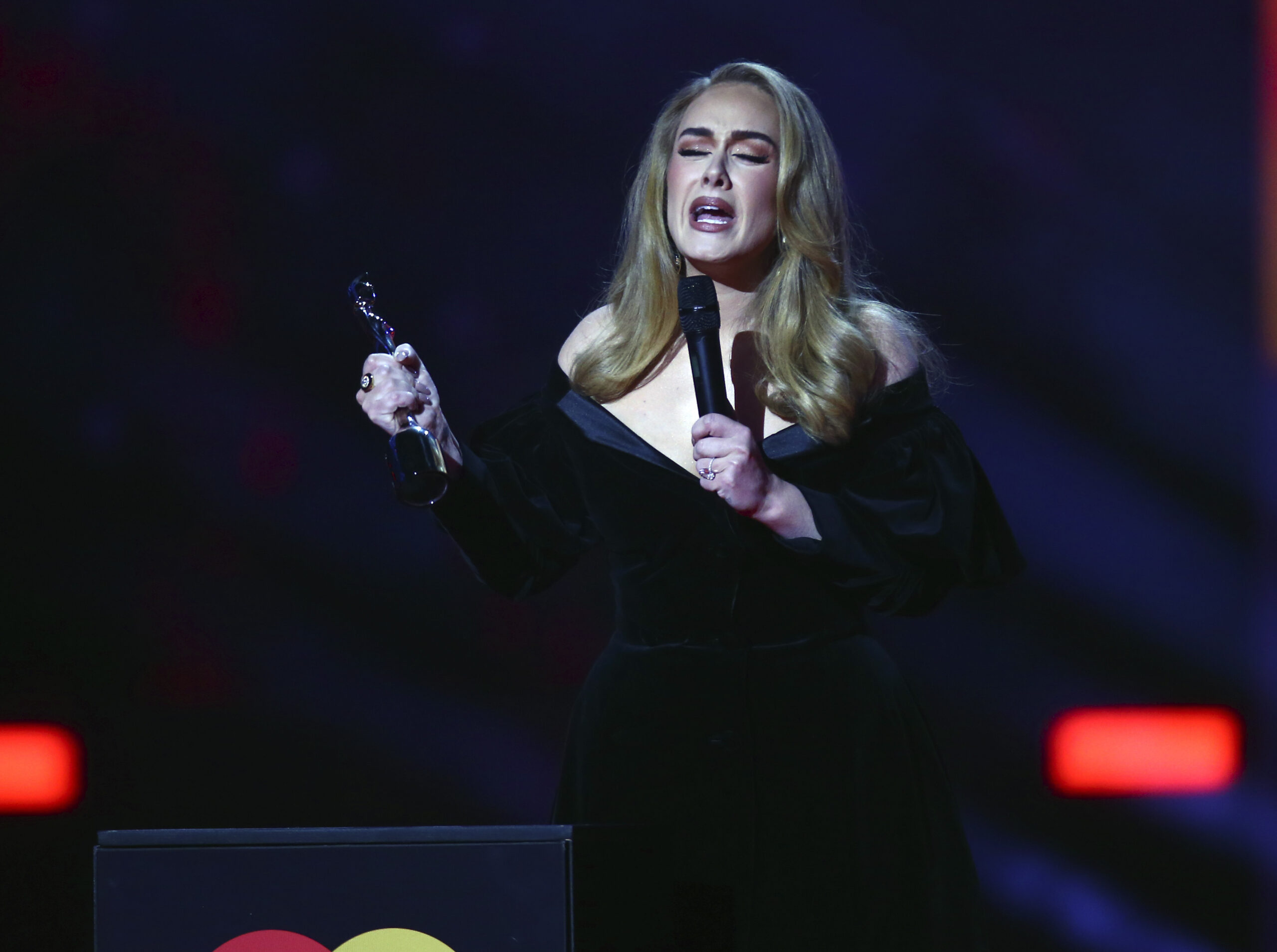 Adele on stage to accept her award for Artist of the Year at the Brit Awards 2022 in London Tuesday, Feb. 8, 2022. (Photo by Joel C Ryan/Invision/AP)