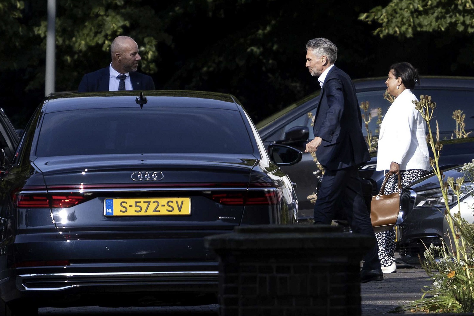 epa11547892 Dutch Prime Minister Dick Schoof (C) and State Secretary for Primary Education and Emancipation Marielle Paul (R) leave after a meeting of the Dutch cabinet, at the Catshuis in The Hague, the Netherlands, 13 August 2024. Dutch cabinet members held an informal meeting, the first since their vacation, at the Catshuis, the official residence of the Dutch prime minister, due to the renovation of the Binnenhof.  EPA/RAMON VAN FLYMEN