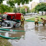 epa11555006 Firefighters work to pump out water from a flooded street after heavy rainfall in Ostrow Wielkopolski, west-central Poland, 19 August 2024. Heavy rains caused floods and traffic problems in Wielkopolska province.  EPA/Tomasz Wojtasik POLAND OUT