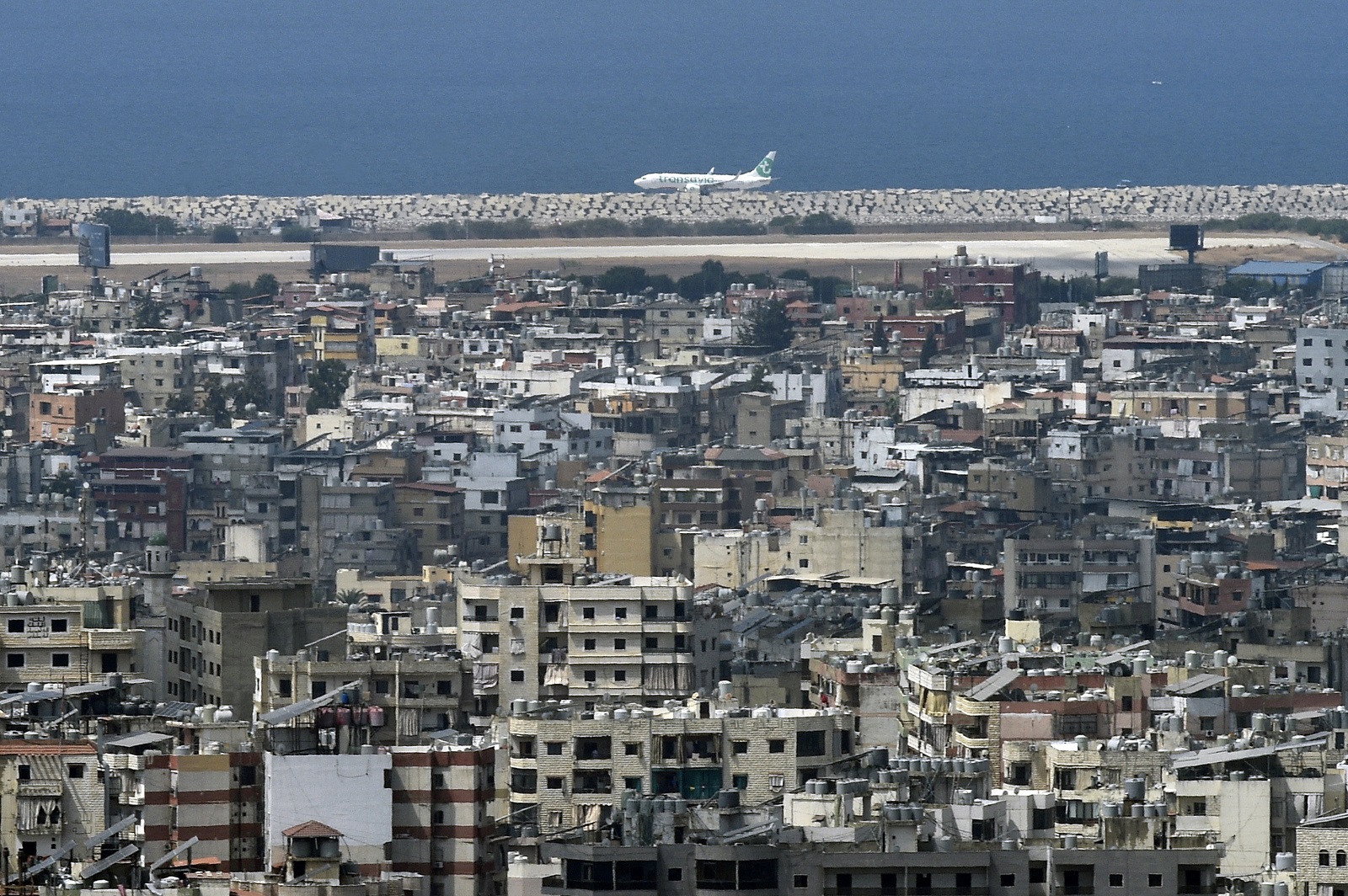 epa11566793 A Transavia Airlines plane lands at Beirut-Rafic Hariri International Airport, Lebanon, 27 August 2024. Hezbollah announced in a statement on 25 August that the group launched an aerial operation with numerous drones targeting Israeli territory as the 'phase one' of a retaliatory attack for the killing of senior Hezbollah commander Fuad Shukr on 30 July in Beirut. The Israeli Defense Forces (IDF) said some 100 fighter jets struck and destroyed thousands of Hezbollah rocket launcher barrels, aimed for immediate fire toward northern and central Israel.  EPA/WAEL HAMZEH