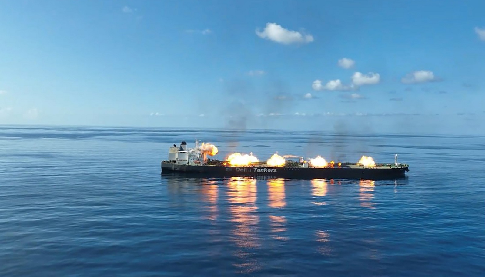 epa11571830 A handout photo made available by the Houthis media center shows smoke rising from the Greek-flagged oil tanker Sounion following Yemen's Houthis attacks, in the Red Sea, 29 August 2024. Yemen's Houthis have agreed to allow tugboats and rescue ships to access the damaged crude oil tanker Sounion in the Red Sea a week after they attacked it, according to a statement by Houthi spokesperson Muhammad Abdul-Salam. The Greek-flagged oil tanker Sounion, which has been on fire since 23 August in the Red Sea following Yemen's Houthis attacks, is still burning and it appears to be leaking oil, a US Pentagon spokesman said. Yemen's Houthis have claimed responsibility for a two-small boats and three projectiles attack against the oil tanker Sounion in the Red Sea off Yemen on 21 August 2024, Houthi military spokesman Yahya Sarea said in a statement.  EPA/HOUTHIS MEDIA CENTER HANDOUT -- BEST QUALITY AVAILABLE -- HANDOUT EDITORIAL USE ONLY/NO SALES