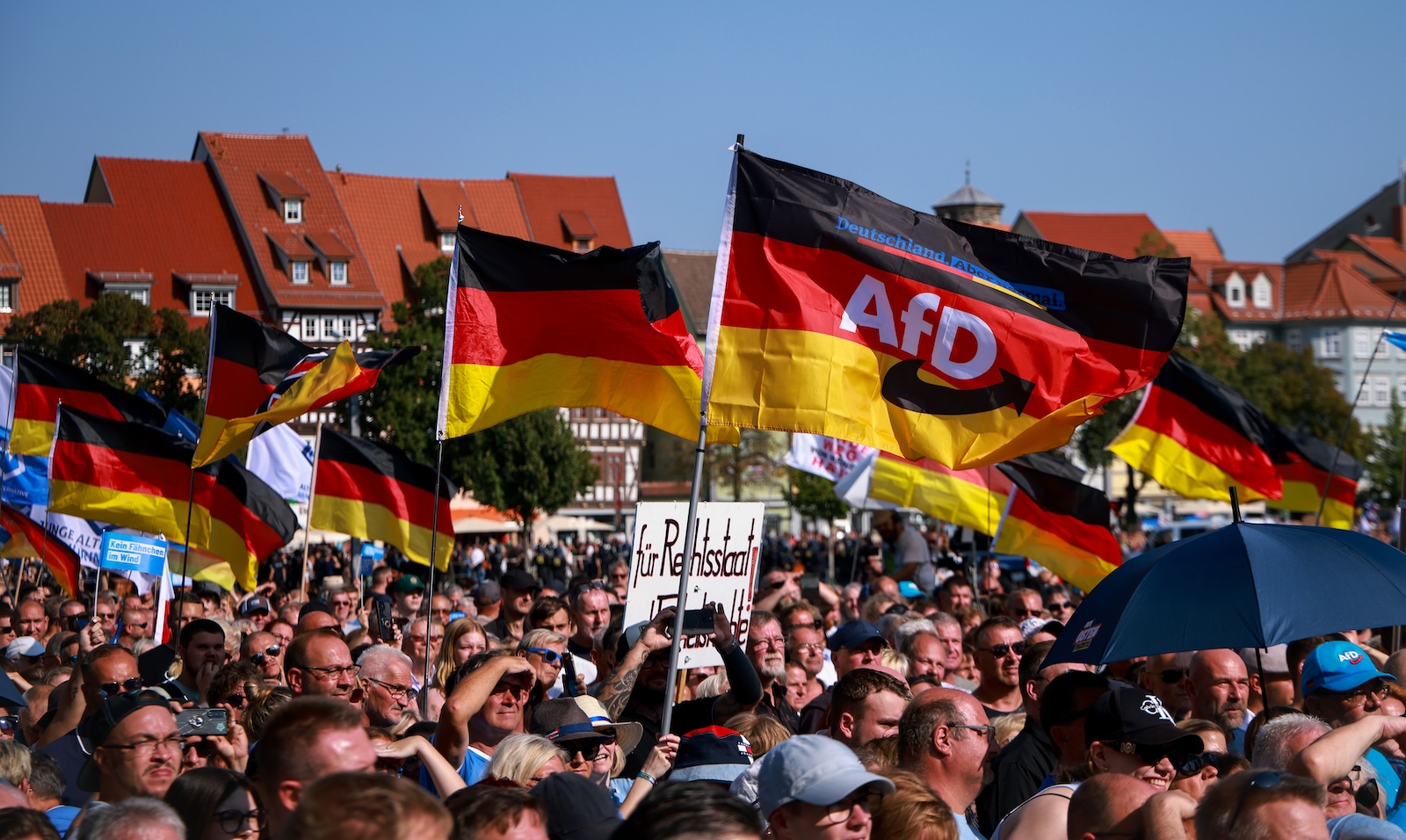 epa11575677 Supporters of far-right Alternative for Germany (AfD) party await the speech of faction chairman in the regional parliament of Thuringia Bjoern Hoecke, top candidate for the upcoming 2024 Thuringia state election during the final election campaign rally in Erfurt, Germany, 31 August 2024. Thuringia state election, voting for the regional parliament 'Landtag', will be held on 01 September 2024.  EPA/CLEMENS BILAN