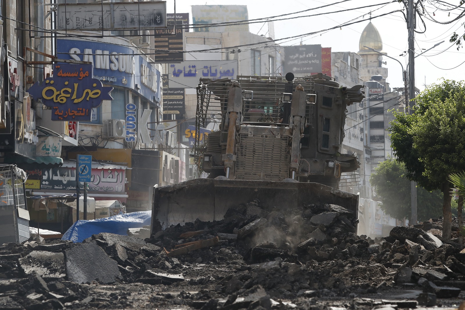 epa11576922 Israeli bulldozers destroy streets and shops  on the fifth day of an Israeli military operation in the West Bank city of Jenin, 01 September 2024. According to the Palestinian Health Ministry, at least 24 Palestinians have been killed since Israeli military operations started on 28 August 2024 in the West Bank cities of Tulkarem, Jenin and Tubas. The Israeli army said that it's conducting a large-scale counter-terrorism operation in several areas. More than 40,000 Palestinians and over 1,400 Israelis have been killed, according to the Palestinian Health Ministry and the Israel Defense Forces (IDF), since Hamas militants launched an attack against Israel from the Gaza Strip on 07 October 2023, and the Israeli operations in Gaza and the West Bank which followed it.  EPA/ALAA BADARNEH