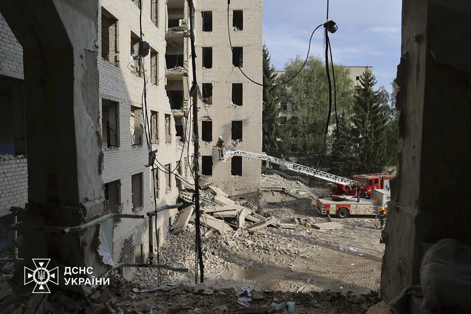 epa11586362 A handout photo released by the press service of the State Emergency Service (SES) of Ukraine shows Ukrainian rescuers working at the site of a rocket strike in Poltava, central Ukraine, 05 September 2024, amid the Russian invasion. As a result of a Russian rocket attack on 03 September 2024, the six-story building of the educational building was partially destroyed, three apartment buildings, five private houses and an office building were damaged. The death toll from a Russian strike on an educational institution in Poltava rose to at least 54 dead and 297 injured, SES said. Ukrainian rescuers continued to work at the site of the attack, where five more people are feared to be trapped under the rubble. Russian troops entered Ukrainian territory on 24 February 2022, starting a conflict that has provoked destruction and a humanitarian crisis.  EPA/STATE EMERGENCY SERVICE OF UKRAINE HANDOUT -- BEST QUALITY AVAILABLE -- MANDATORY CREDIT: STATE EMERGENCY SERVICE OF UKRAINE -- HANDOUT EDITORIAL USE ONLY/NO SALES