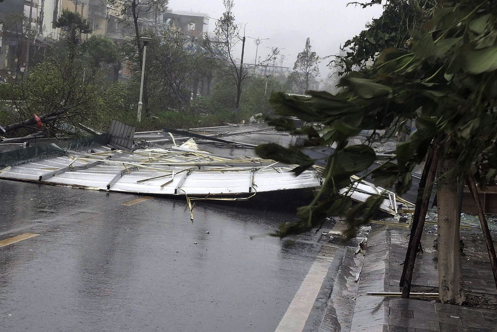 epa11590854 A handout photo made available by Vietnam News Agency shows debris on a street as typhoon Yagi makes landfall, in Quang Ninh province, Vietnam, 07 September 2024. Typhoon Yagi, Asia's most powerful storm so far this year, made landfall in northern Vietnam on 07 September with wind speeds up to 149 kilometers per hour, according to the National Centre for Hydro-Meteorological Forecasting.  EPA/VIETNAM NEWS AGENCY/HANDOUT VIETNAM OUTHANDOUT EDITORIAL USE ONLY/NO SALES