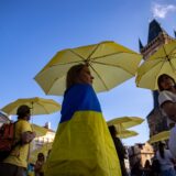 epa11591859 People create a map of Ukraine from blue-yellow umbrellas in support of Ukraine, at the Old Town Square in Prague, Czech Republic, 07 September 2024. Tens of participants took part in an event tittled 'Let Ukraine Strike Back' and again call on world leaders to step up their support for Ukraine and commemorate all the victims of the Russian invasion of Ukraine.  EPA/MARTIN DIVISEK