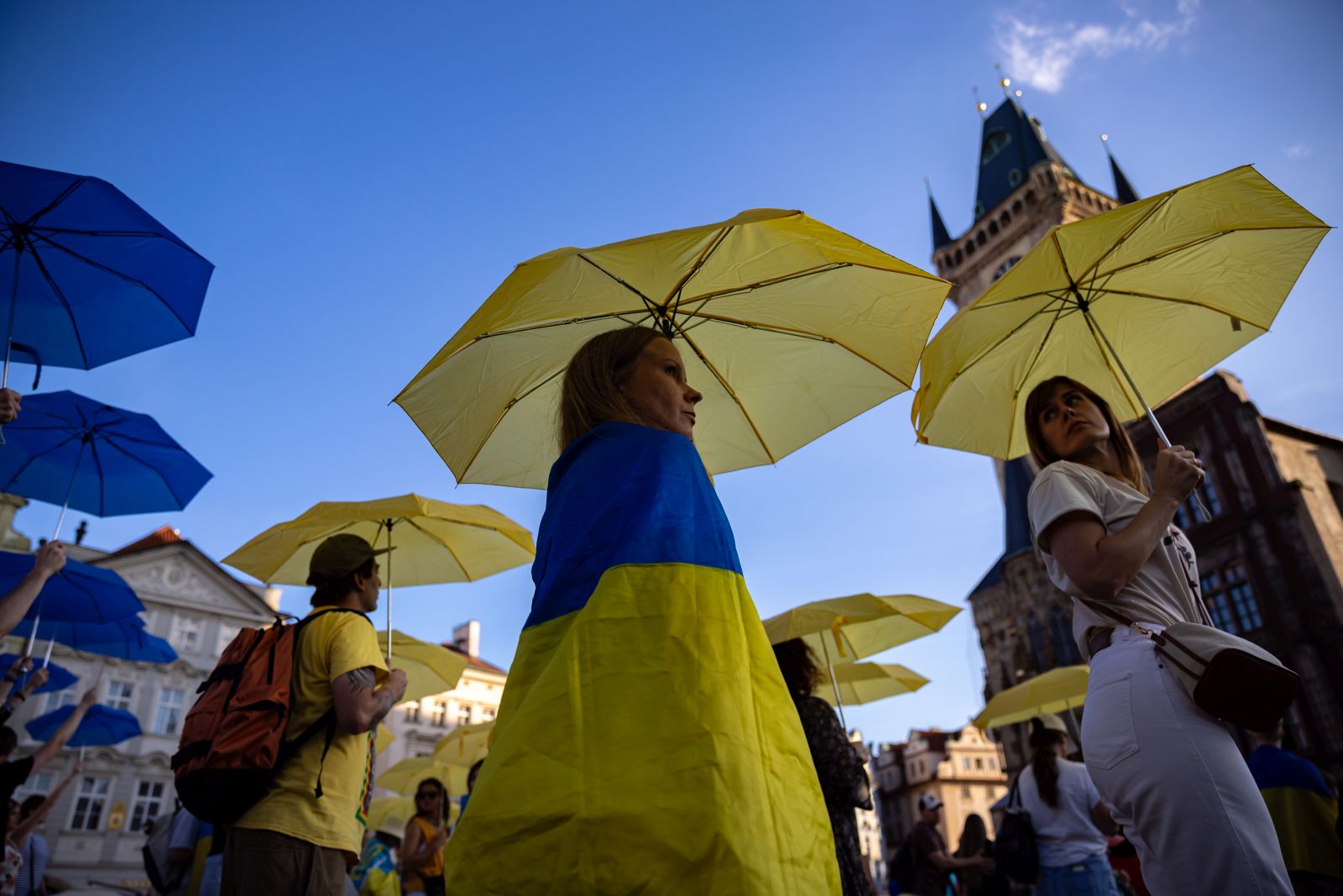 epa11591859 People create a map of Ukraine from blue-yellow umbrellas in support of Ukraine, at the Old Town Square in Prague, Czech Republic, 07 September 2024. Tens of participants took part in an event tittled 'Let Ukraine Strike Back' and again call on world leaders to step up their support for Ukraine and commemorate all the victims of the Russian invasion of Ukraine.  EPA/MARTIN DIVISEK