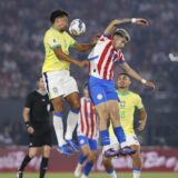 epa11597542 Julio Enciso (R) of Paraguay in action against Marquinhos (L) of Brazil during a CONMEBOL FIFA World Cup 2026 qualifier soccer match between Paraguay and Brazil at Defensores del Chaco in Asuncion, Paraguay, 10 September 2024.  EPA/Juan Pablo Pino