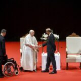 epa11599443 Pope Francis and Singaporean President Tharman Shanmugaratnam shake hands during a meeting with authorities, civil society, and the diplomatic corps at the Cultural Centre of the National University of Singapore (NUS), in Singapore, 12 September 2024. Pope Francis is visiting Singapore from 11 to 13 September, marking the final stop of his apostolic journey through the Asia-Pacific region, which also includes Indonesia, Papua New Guinea, and East Timor.  EPA/ALESSANDRO DI MEO