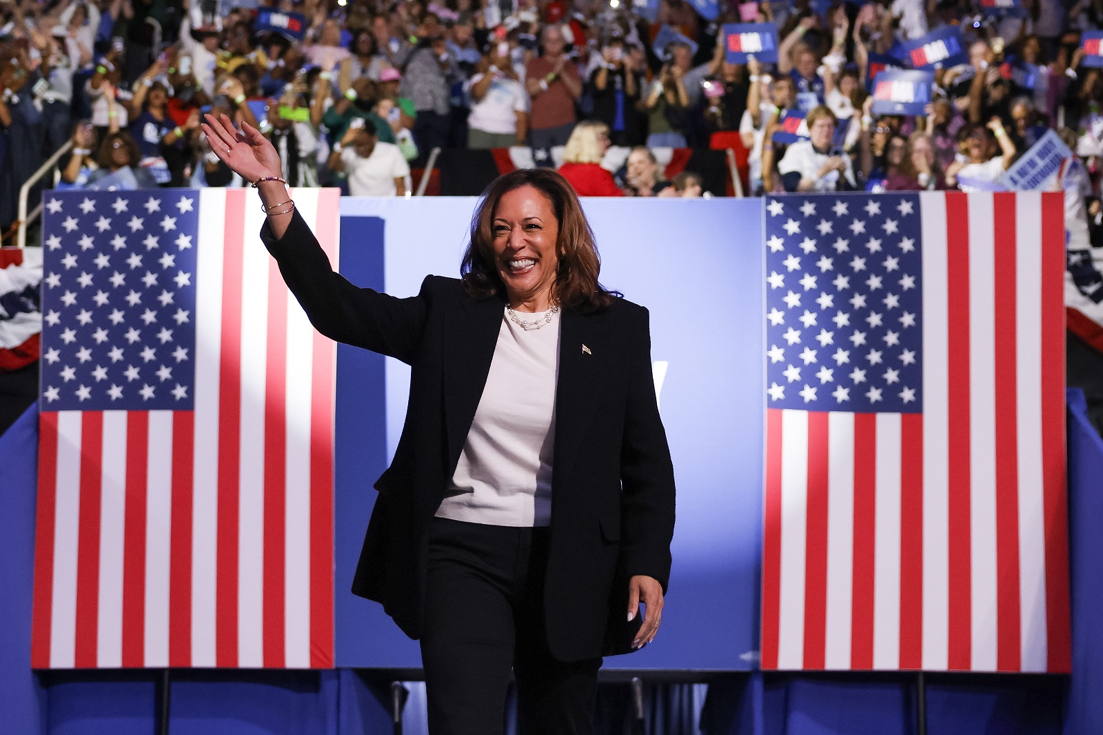 epa11600958 Vice President and Democratic presidential nominee Kamala Harris takes to the stage as she participates in a campaign rally at the Bojangles Arena in Charlotte, North Carolina, USA, 12 September 2024. Harris is running against former US President and Republican nominee Donald Trump.  EPA/ERIK S. LESSER