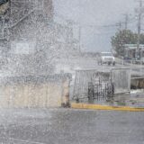 epa11627267 A car passes on a flooded street with high surf, storm surge and high winds of Hurricane Helene at the downtown of Cedar Key, Florida, USA, 26 September 2024. Hurricane Helene is strengthening as it moves toward the U.S. Gulf Coast becoming a Category 1 hurricane and is expected to hit Florida's Big Bend late today as Category 4 storm. Around 32 million people are under flood watches.  EPA/CRISTOBAL HERRERA-ULASHKEVICH