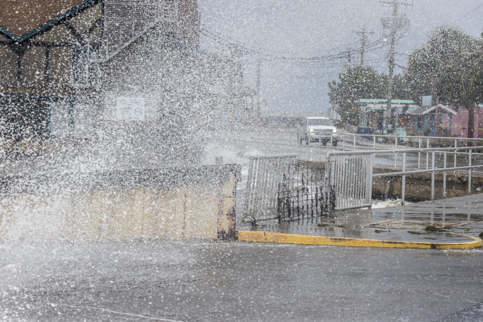 epa11627267 A car passes on a flooded street with high surf, storm surge and high winds of Hurricane Helene at the downtown of Cedar Key, Florida, USA, 26 September 2024. Hurricane Helene is strengthening as it moves toward the U.S. Gulf Coast becoming a Category 1 hurricane and is expected to hit Florida's Big Bend late today as Category 4 storm. Around 32 million people are under flood watches.  EPA/CRISTOBAL HERRERA-ULASHKEVICH