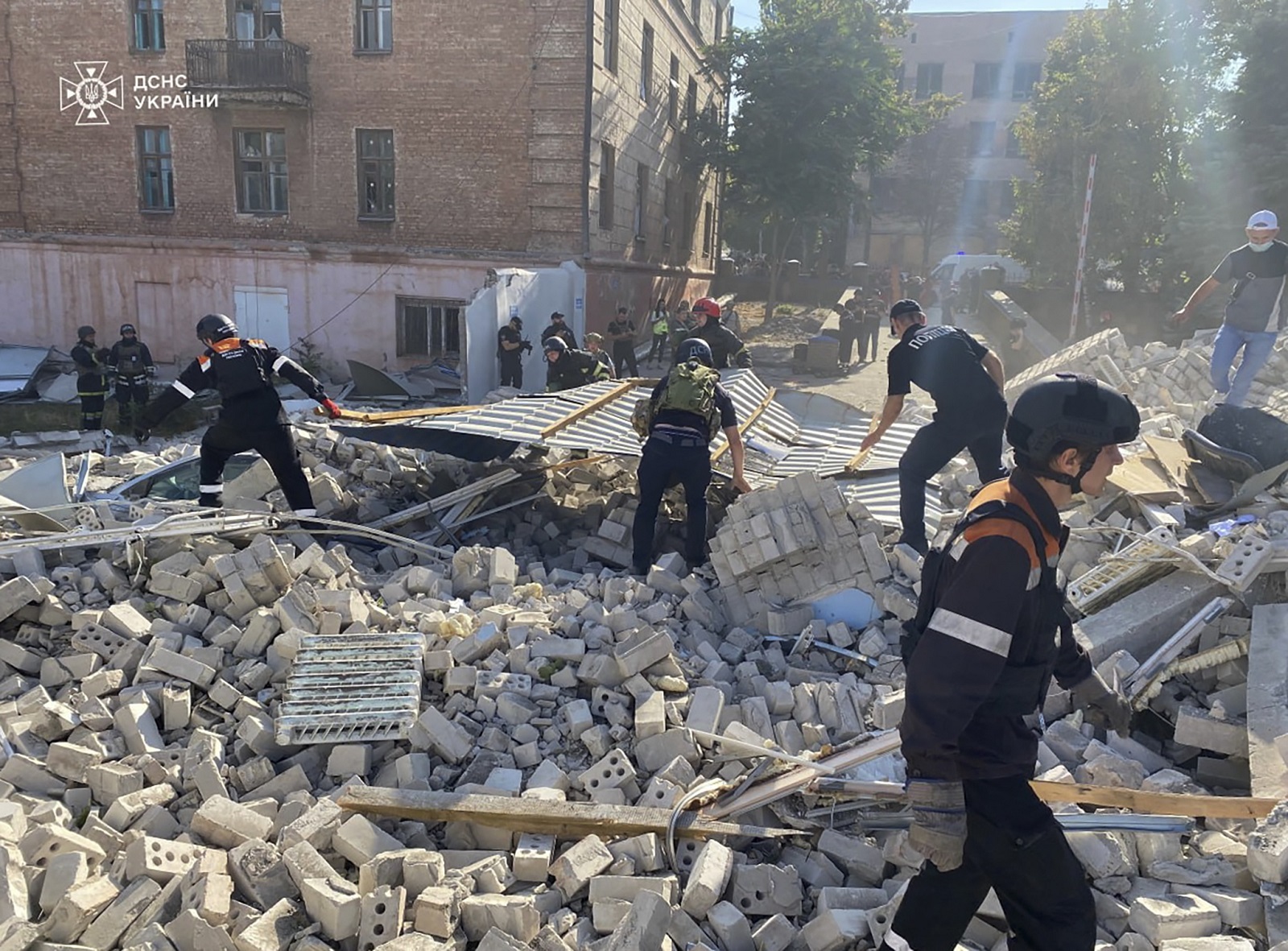 epa11628508 A handout photo made available by the State Emergency Service shows Ukrainian rescuers work at the site of National Police headquarters following a shelling in Kryvyi Rih, Ukraine, 27 September 2024. One woman was found dead in the rubble following a Russian missile strike on the National Police headquarters, the Head of Dnipropetrovsk Oblast Military Administration said. Russian troops entered Ukrainian territory on 24 February 2022, starting a conflict that has provoked destruction and a humanitarian crisis.  EPA/State Emergency Service / HANDOUT  HANDOUT EDITORIAL USE ONLY/NO SALES