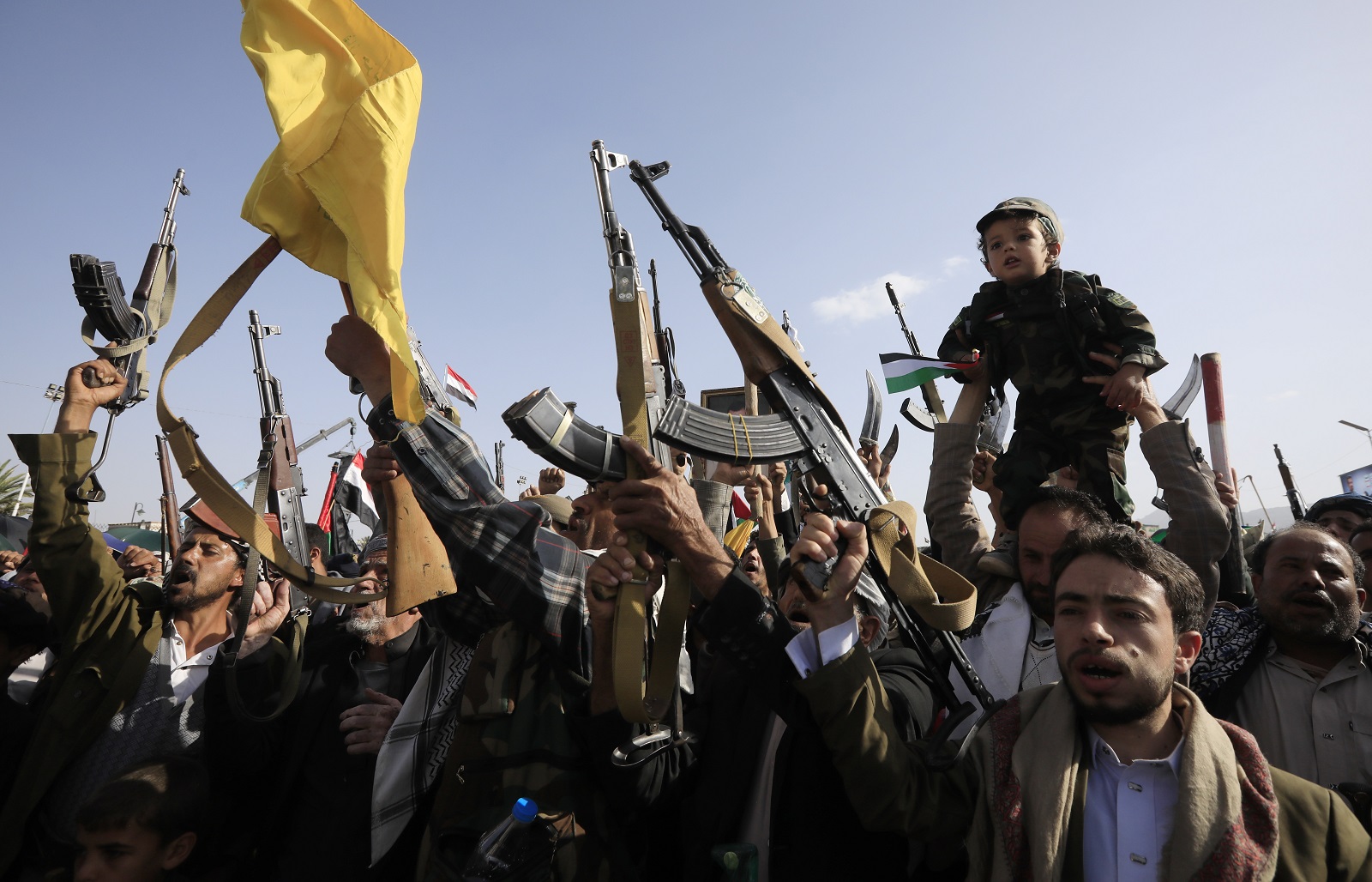 epa11628876 Houthi supporters hold up their weapons as they take part in a protest in solidarity with the Lebanese and Palestinian people in Sana'a, Yemen, 27 September 2024. Yemen's Houthis have claimed responsibility for a missile attack on Isreal on 26 September, according to a statement by Houthi military spokesman Yahya Sarea. The Israeli military said they intercepted a surface-to-surface missile outside of Israeli territory that was launched from Yemen.  EPA/YAHYA ARHAB