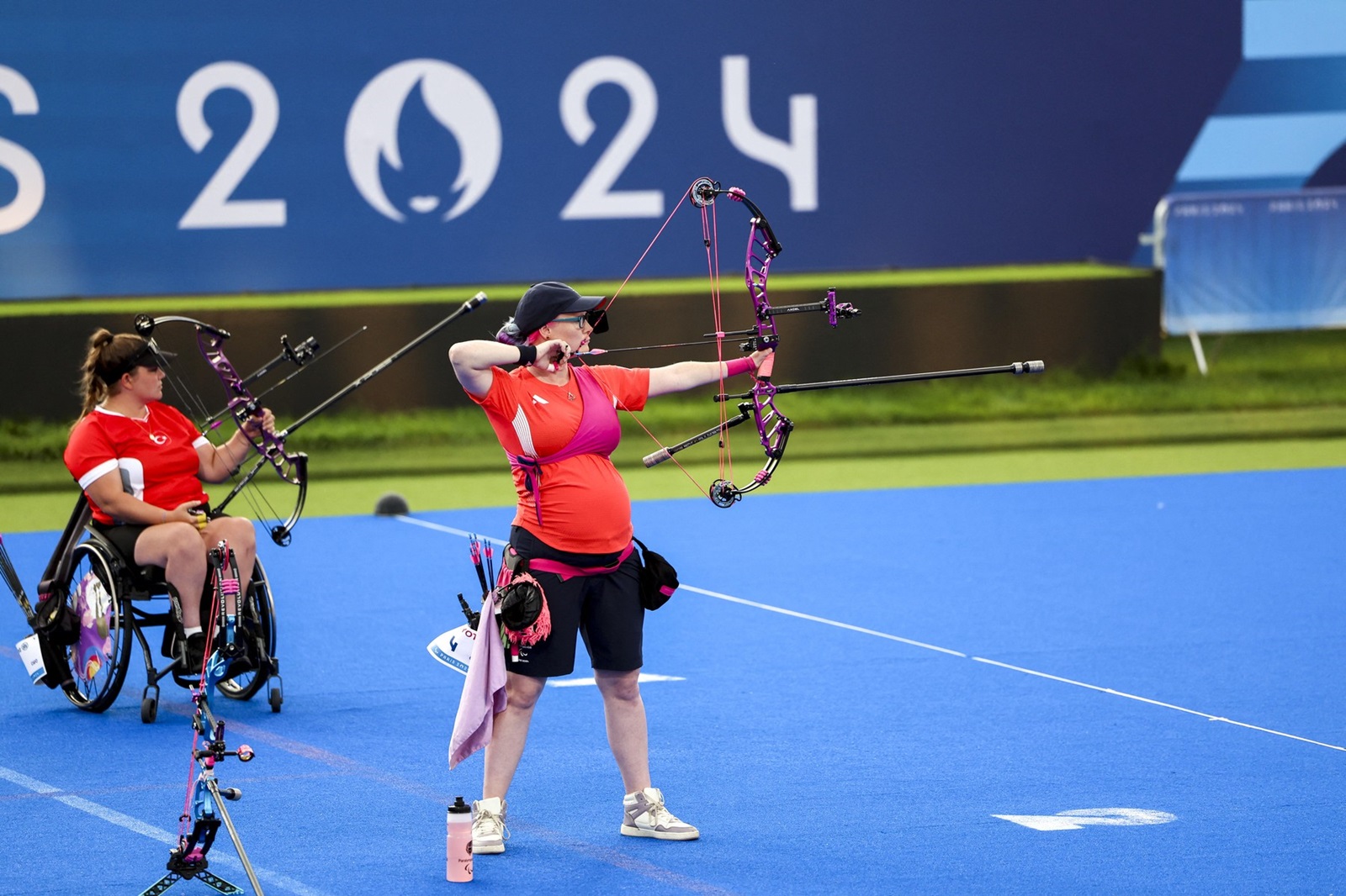 PARIS, FRANCE - AUGUST 31: Oznur Cure Girdi (rear) of Team Turkiye competes against Jodie Grinham of Great Britain (left) during their women's individual compound open semi-final match on day three of the Paris 2024 Paralympic Games at Eplanade des Invalides in Paris, France on August 31, 2024. Ahmet Izgi / Anadolu/ABACAPRESS.COM,Image: 903531759, License: Rights-managed, Restrictions: , Model Release: no, Credit line: AA/ABACA / Abaca Press / Profimedia