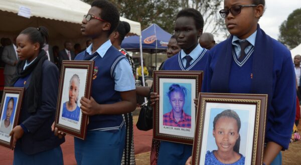 Students carry the photo's accompanied by  relatives of the girls who died in the Moi Girls School dormitory fire, September 14, 2017 attend a requiem mass at the school in Nairobi. A 14-year-old Kenyan girl was charged on September 13 with multiple counts of murder for allegedly starting a fire at a Nairobi school dormitory that left nine other schoolgirls dead. According to a source inside the court, where proceedings were held in camera due to the age of the accused, the girl denied starting the fire on September 2 at the Moi Girls High School.,Image: 349356340, License: Rights-managed, Restrictions: , Model Release: no, Credit line: SIMON MAINA / AFP / Profimedia