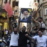 BEIRUT, LEBANON - SEPTEMBER 28: A group gather carrying Nasrallah's poster and chanting slogans following Hezbollah's statement after Hezbollah Secretary General Hassan Nasrallah was killed yesterday in Israeli airstrikes in Beirut, Lebanon on September 28, 2024. Houssam Shbaro / Anadolu,Image: 913191344, License: Rights-managed, Restrictions: , Model Release: no, Credit line: Houssam Shbaro / AFP / Profimedia