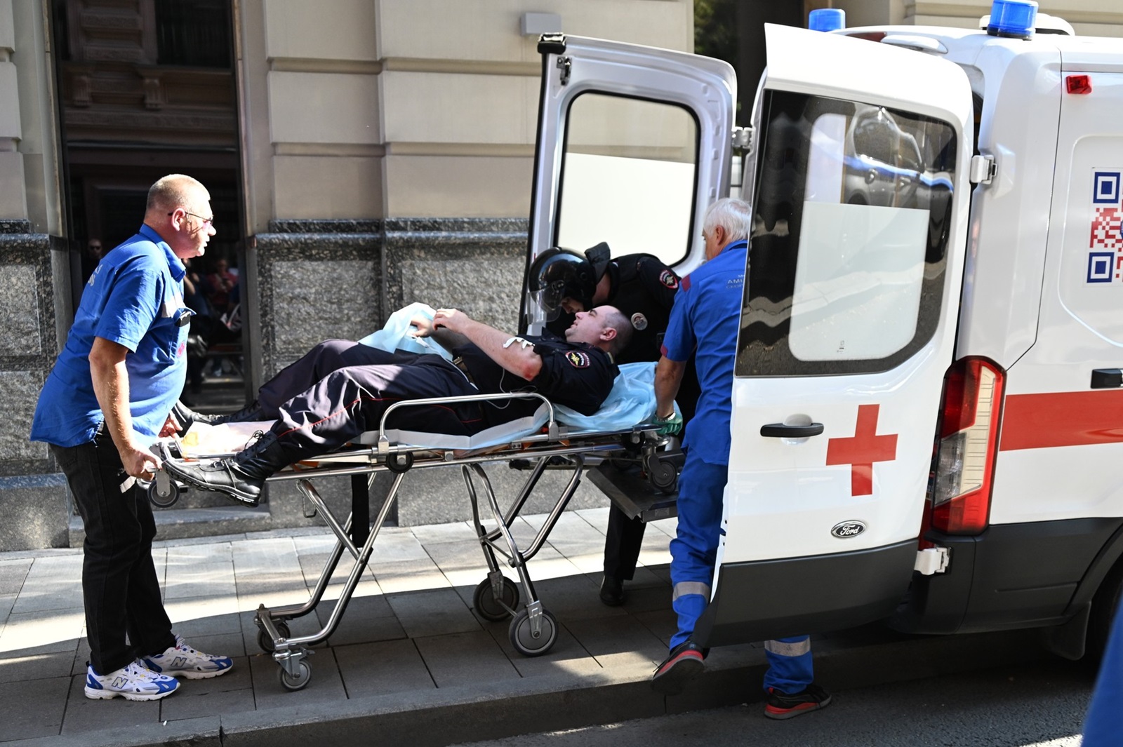 8767824 18.09.2024 Medical workers transport a police officer injured in the shooting outside the headquarters of Russian online retailer Wildberries in Moscow, Russia. The scuffle reportedly began when a group of men, including Vladislav Bakalchuk, the ex-husband of Wildberries founder Tatiana Bakalchuk, attempted to enter the building. The incident follows ongoing tensions surrounding Wildberries after it announced a merger with Russ Group over the summer, forming a new digital trading platform named RWB.,Image: 909453220, License: Rights-managed, Restrictions: Editors' note: THIS IMAGE IS PROVIDED BY RUSSIAN STATE-OWNED AGENCY SPUTNIK., Model Release: no, Credit line: Anton Vylekzhanin / Sputnik / Profimedia