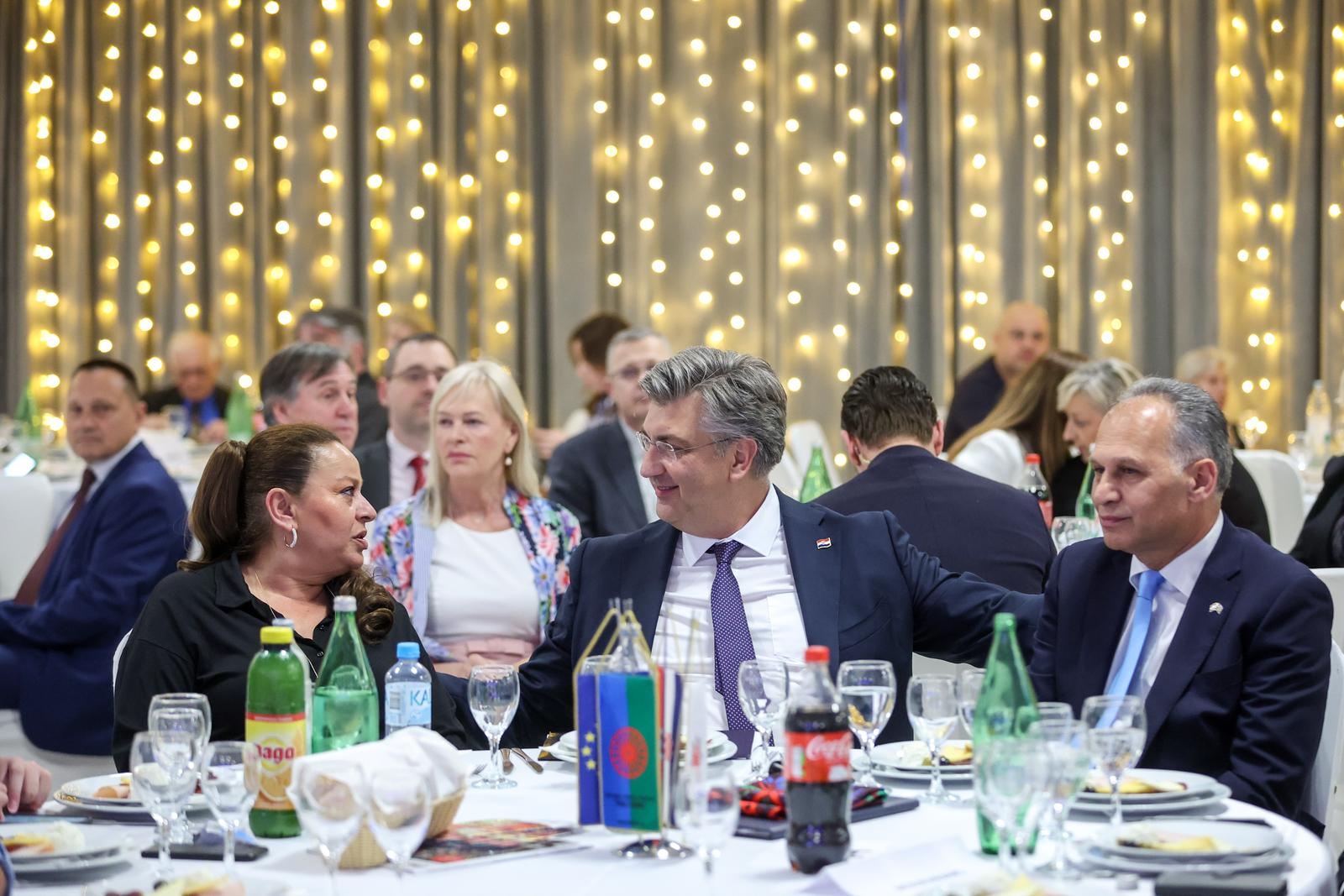 08.04.2024., Zagreb - Premijer Andrej Plenkovic na obiljezavanju Svjetskog dana Roma u Gastro Globusu na zagrebackom Velesajamu. Suzana Krcmar, Andrej Plenkovic, Veljko Kajtazi. Photo: Igor Kralj/PIXSELL