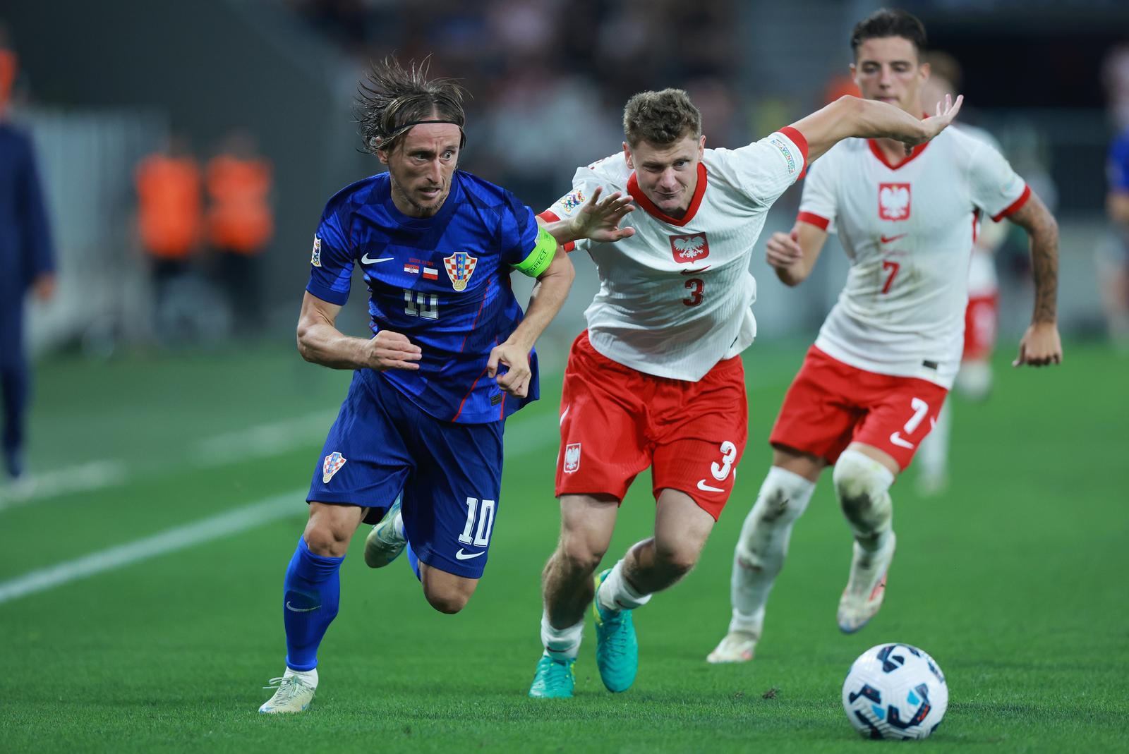 08.09.2024., Opus Arena, Osijek - UEFA Liga nacija, Liga A, skupina 1, 2. kolo, Hrvatska - Poljska. Luka Modric, Pawel Dawidowicz, Kacper Urbanski. Photo: Davor Javorovic/PIXSELL