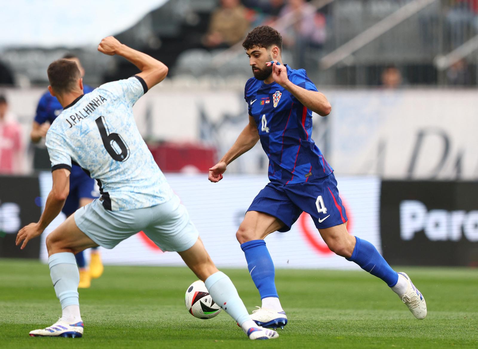 Soccer Football - International Friendly - Portugal v Croatia - Centro Desportivo Nacional do Jamor, Oeiras, Portugal - June 8, 2024 Croatia's Josko Gvardiol in action with Portugal's Joao Palhinha REUTERS/Pedro Nunes Photo: PEDRO NUNES/REUTERS