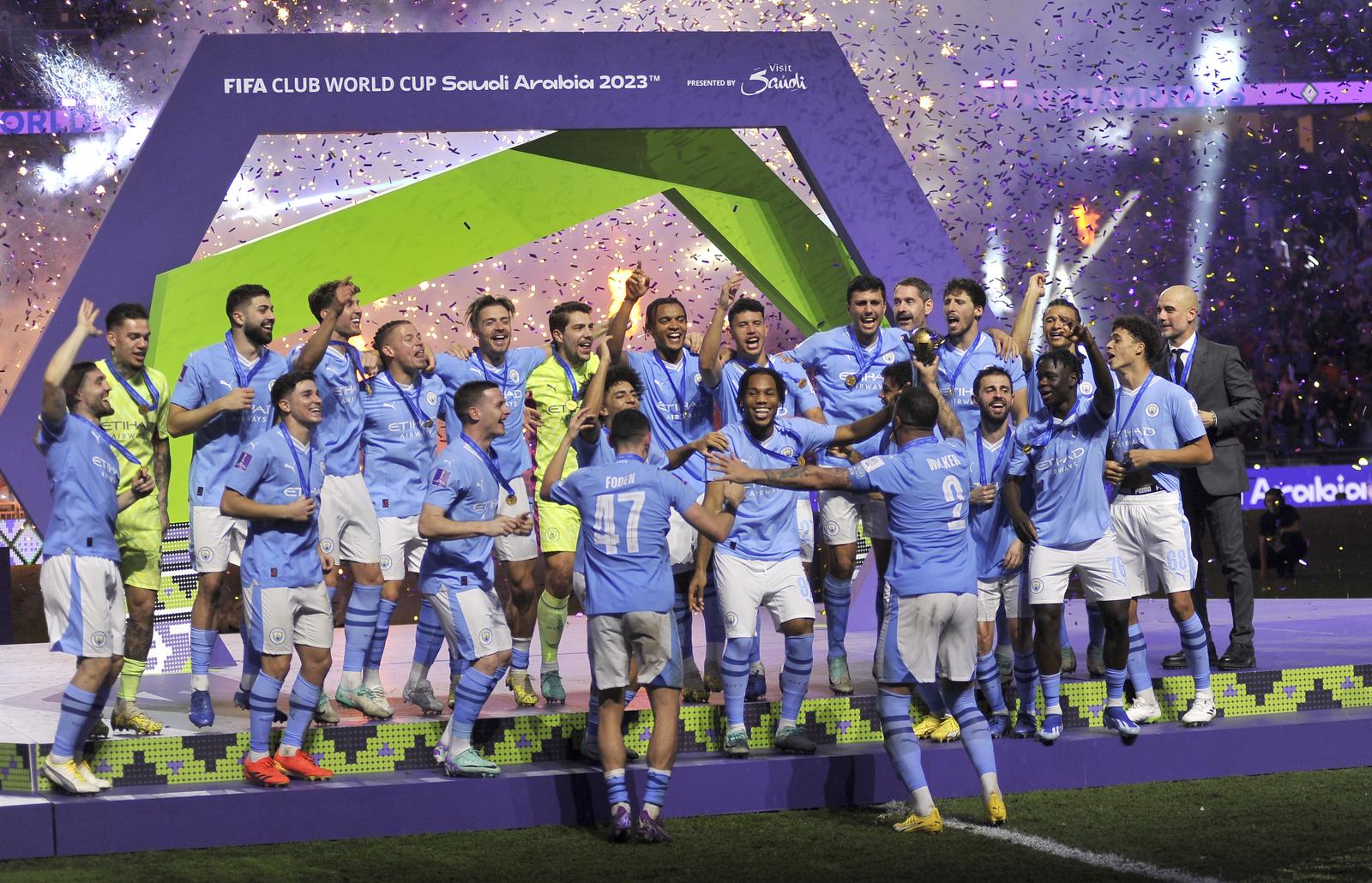 Soccer Football - Club World Cup - Final - Manchester City v Fluminense - King Abdullah Sports City, Jeddah, Saudi Arabia - December 22, 2023 Manchester City's Kyle Walker lifts the trophy alongside teammates after winning the Club World Cup final REUTERS/Osama Abd El Naby Photo: OSAMA ABD EL NABY/REUTERS