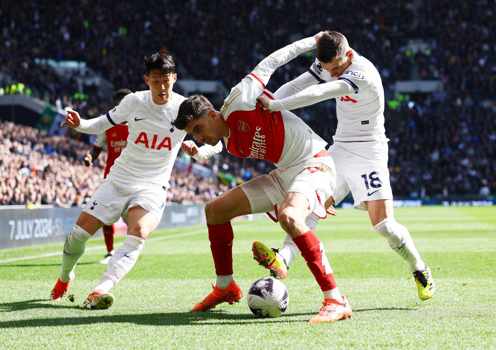 Soccer Football - Premier League - Tottenham Hotspur v Arsenal - Tottenham Hotspur Stadium, London, Britain - April 28, 2024 Arsenal's Kai Havertz in action with Tottenham Hotspur's Son Heung-min and Giovani Lo Celso Action Images via Reuters/Paul Childs NO USE WITH UNAUTHORIZED AUDIO, VIDEO, DATA, FIXTURE LISTS, CLUB/LEAGUE LOGOS OR 'LIVE' SERVICES. ONLINE IN-MATCH USE LIMITED TO 45 IMAGES, NO VIDEO EMULATION. NO USE IN BETTING, GAMES OR SINGLE CLUB/LEAGUE/PLAYER PUBLICATIONS. Photo: Paul Childs/REUTERS