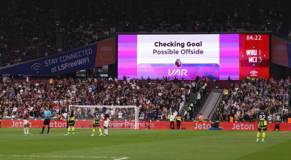 Soccer Football - Premier League - West Ham United v Manchester City - London Stadium, London, Britain - August 31, 2024 A big screen displays a VAR review message REUTERS/Hannah Mckay EDITORIAL USE ONLY. NO USE WITH UNAUTHORIZED AUDIO, VIDEO, DATA, FIXTURE LISTS, CLUB/LEAGUE LOGOS OR 'LIVE' SERVICES. ONLINE IN-MATCH USE LIMITED TO 120 IMAGES, NO VIDEO EMULATION. NO USE IN BETTING, GAMES OR SINGLE CLUB/LEAGUE/PLAYER PUBLICATIONS. PLEASE CONTACT YOUR ACCOUNT REPRESENTATIVE FOR FURTHER DETAILS.. Photo: HANNAH MCKAY/REUTERS